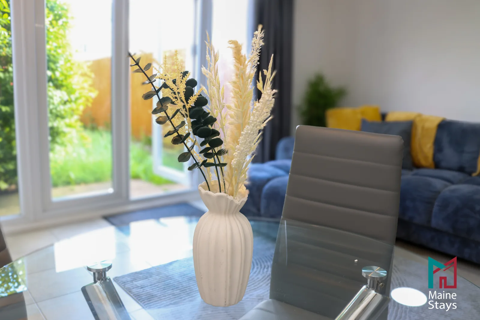 Humber Hub Coventry - Open-plan kitchen, dining and lounge: floral vase dining table